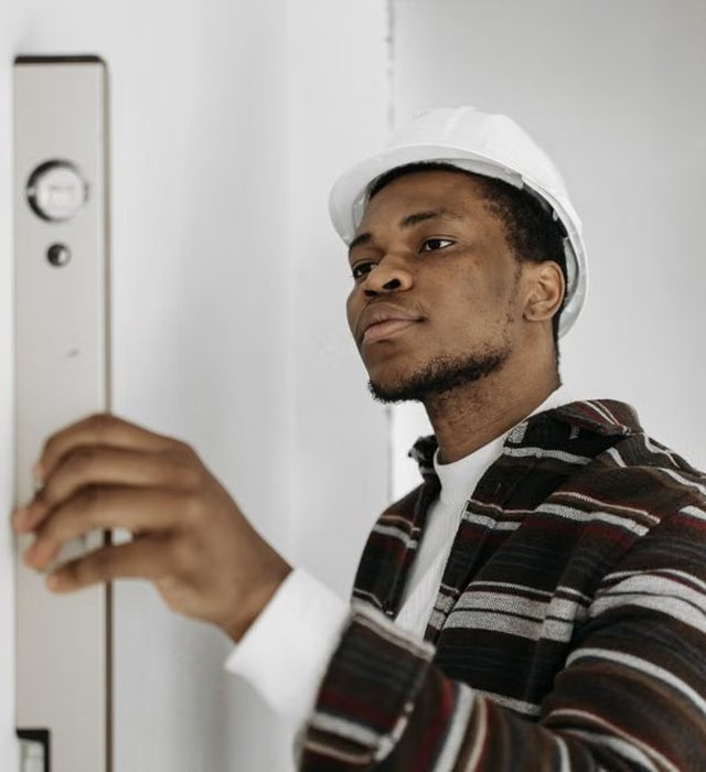 Electrician testing a distribution board
